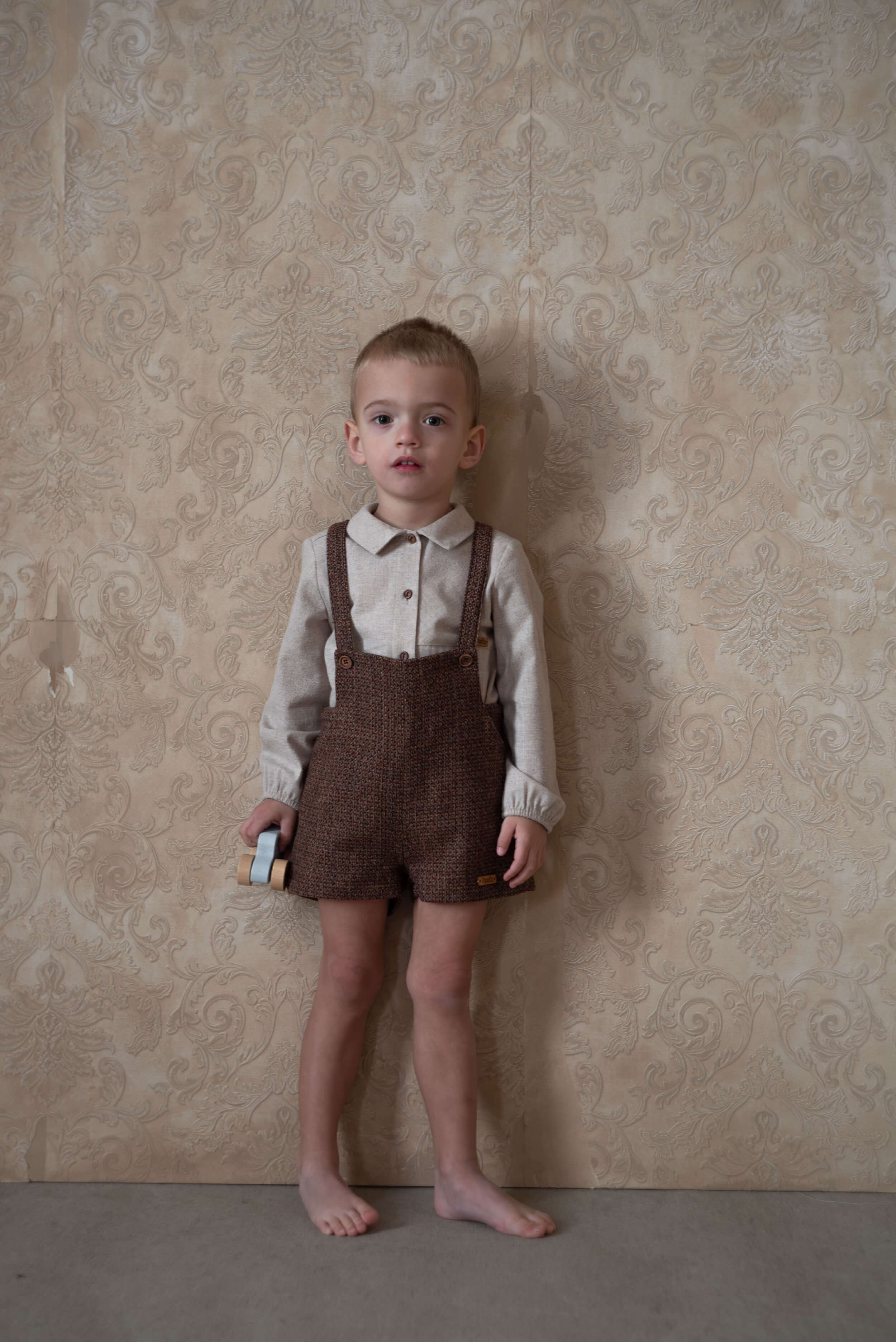 Mod.7.6 Burgundy woollen short romper suit with pockets